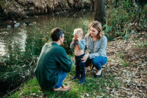 Parents comfort upset toddler during family photo sessions