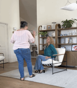 Photographer guiding client through brand photoshoot session, capturing authentic moments